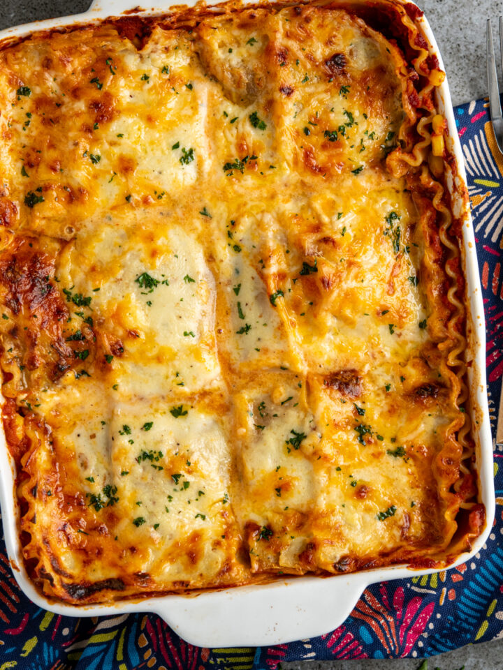 featured image of chicken sweetcorn lasagne with forks place to right of dish