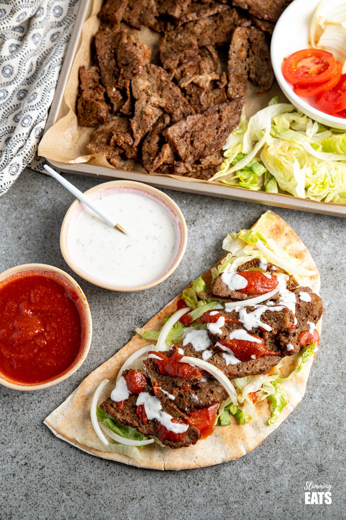 picture of homemade doner kebab with sauces 