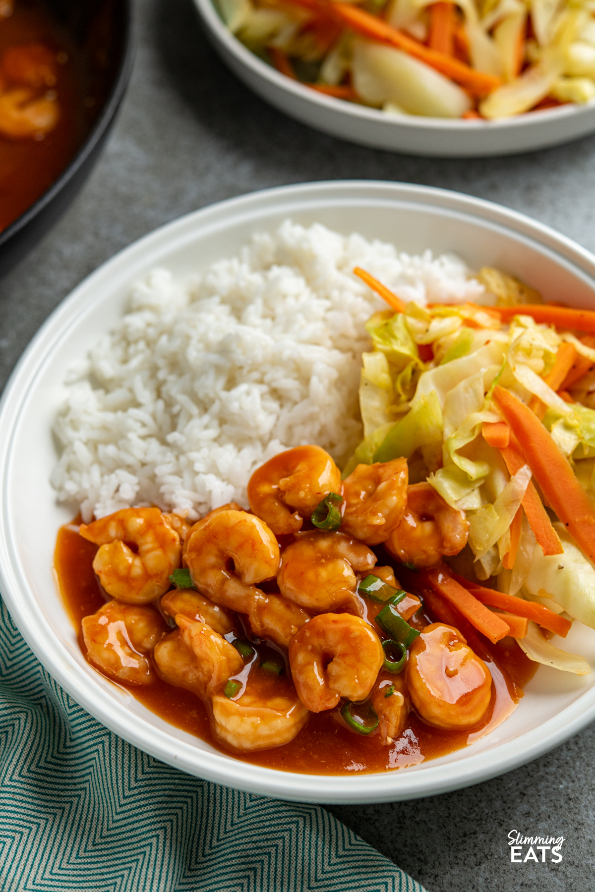 Sweet and Sour Shrimp - A super easy and quick recipe for shrimp in a Chinese style sweet and sour sauce, perfect with rice and some stir fried vegetables. #slimming #weightwatchers sweet and sour shrimp in white bowl with rice and vegetables