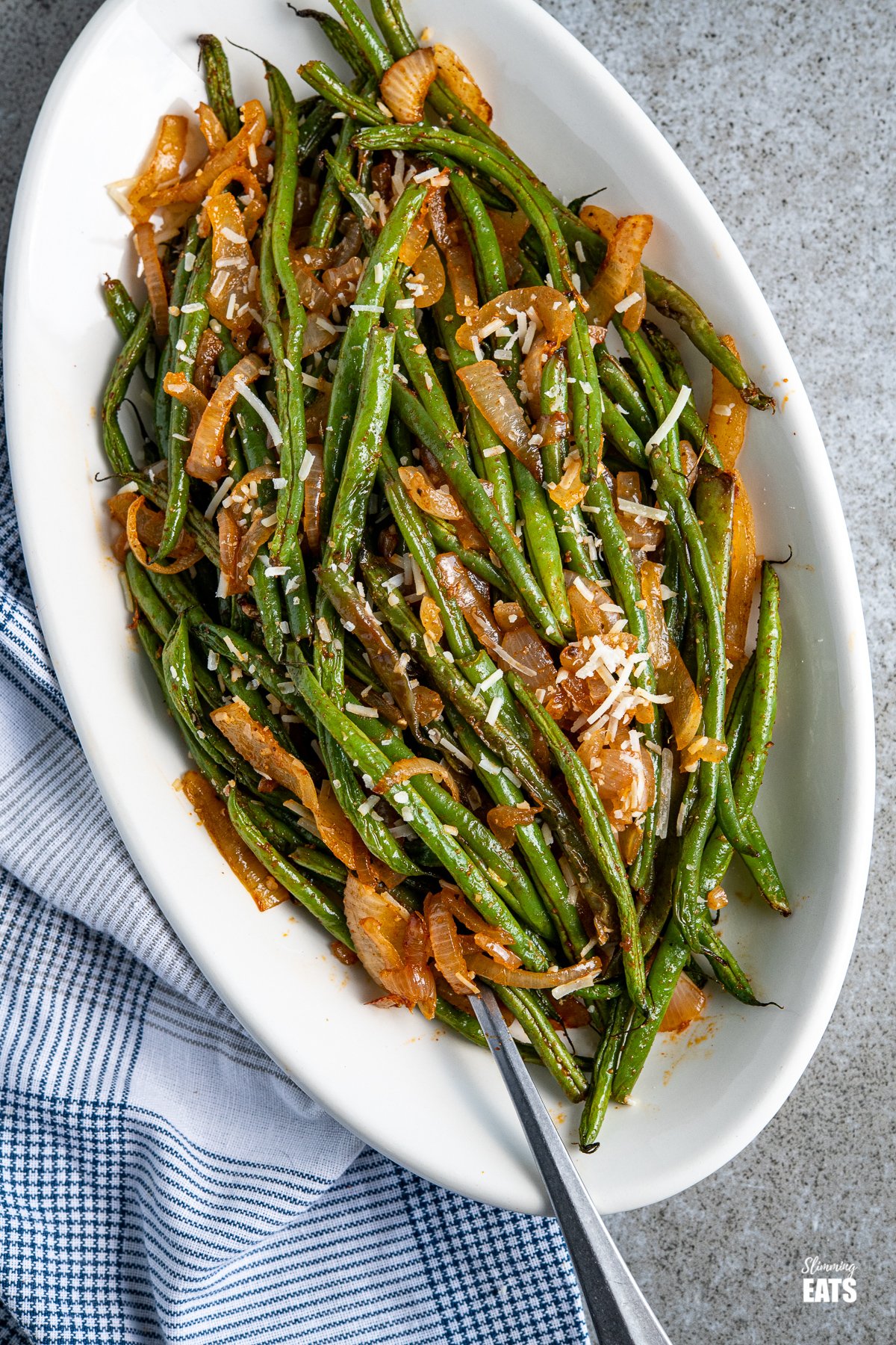 Roasted Green Beans on a oval white plate