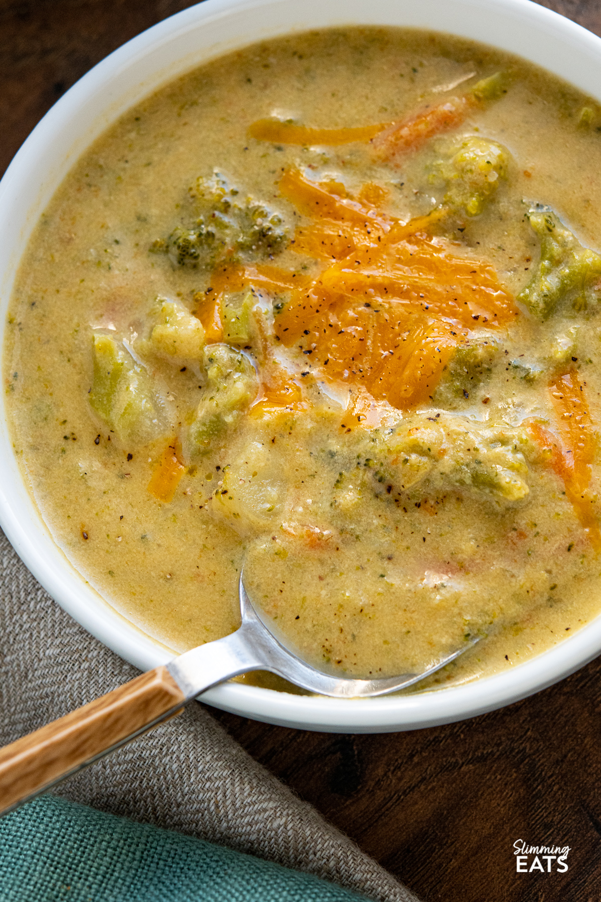 close up of Lighter Broccoli Cheddar Soup in white bowl