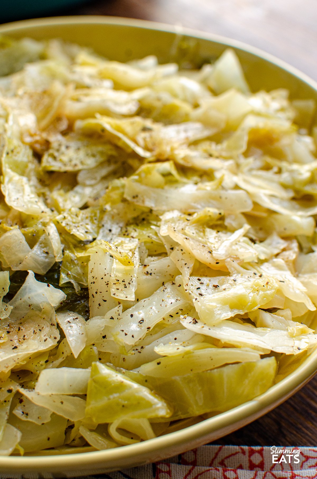 Irish Buttered Cabbage - this simple but delicious side dish of cooked cabbage with butter and black pepper is the perfect recipe for a variety of main dishes. Gluten Free, Slimming Eats and Weight Watchers friendly