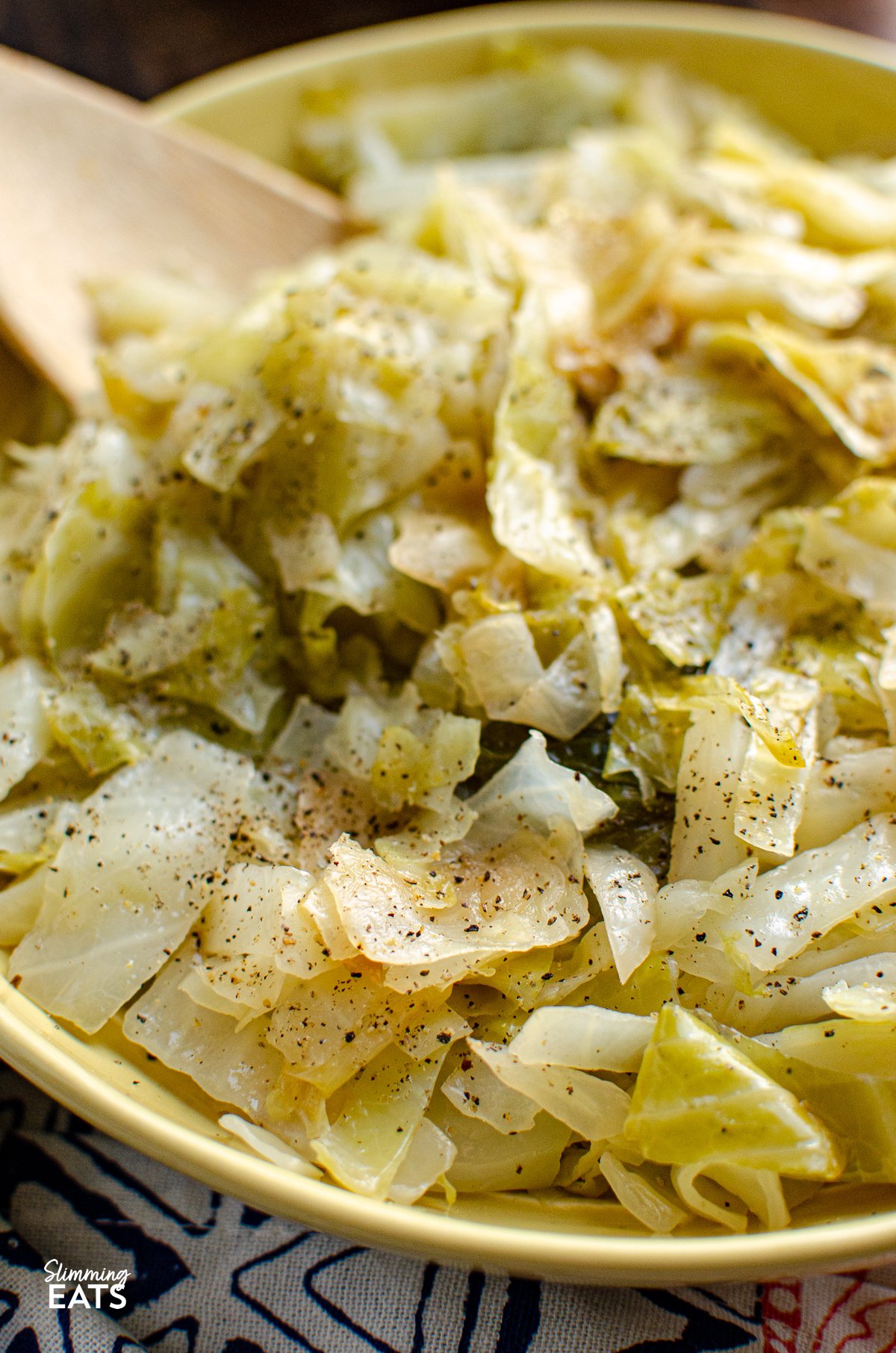 Irish Buttered Cabbage - this simple but delicious side dish of cooked cabbage with butter and black pepper is the perfect recipe for a variety of main dishes. Gluten Free, Slimming Eats and Weight Watchers friendly