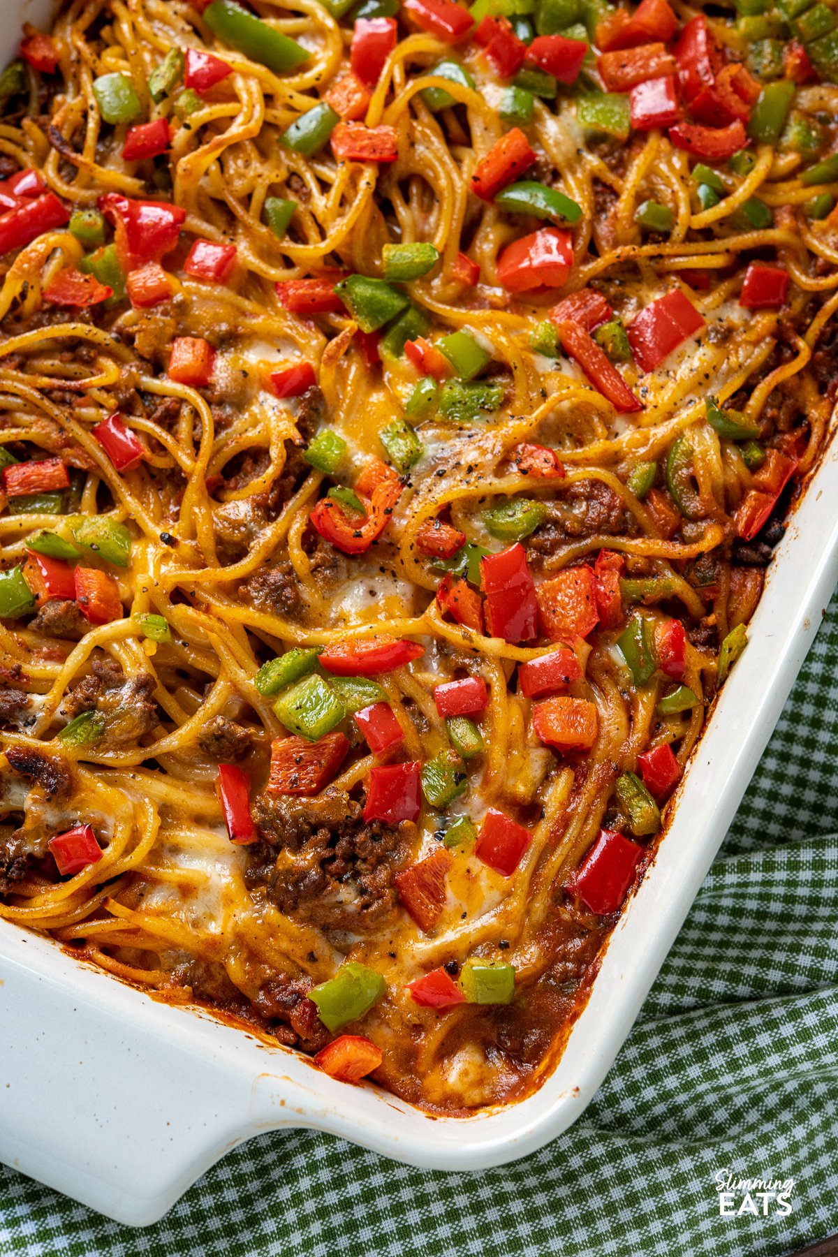 close up of taco spaghetti bake in white oven proof dish
