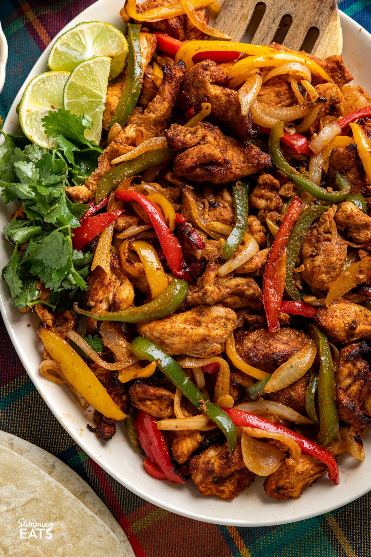 close up of Air Fryer Chicken Fajitas on a large oval plate