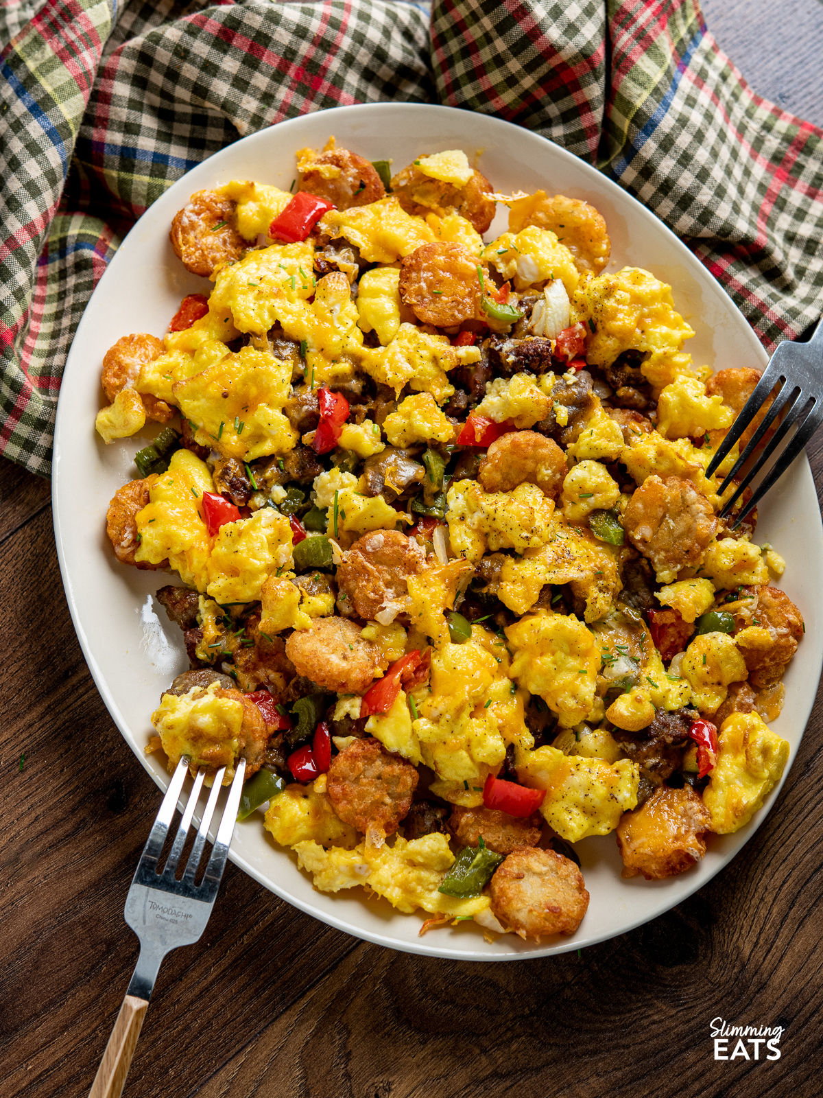 Air Fryer Breakfast Loaded Tater Tots (Totchos) on a oval plate with two forks