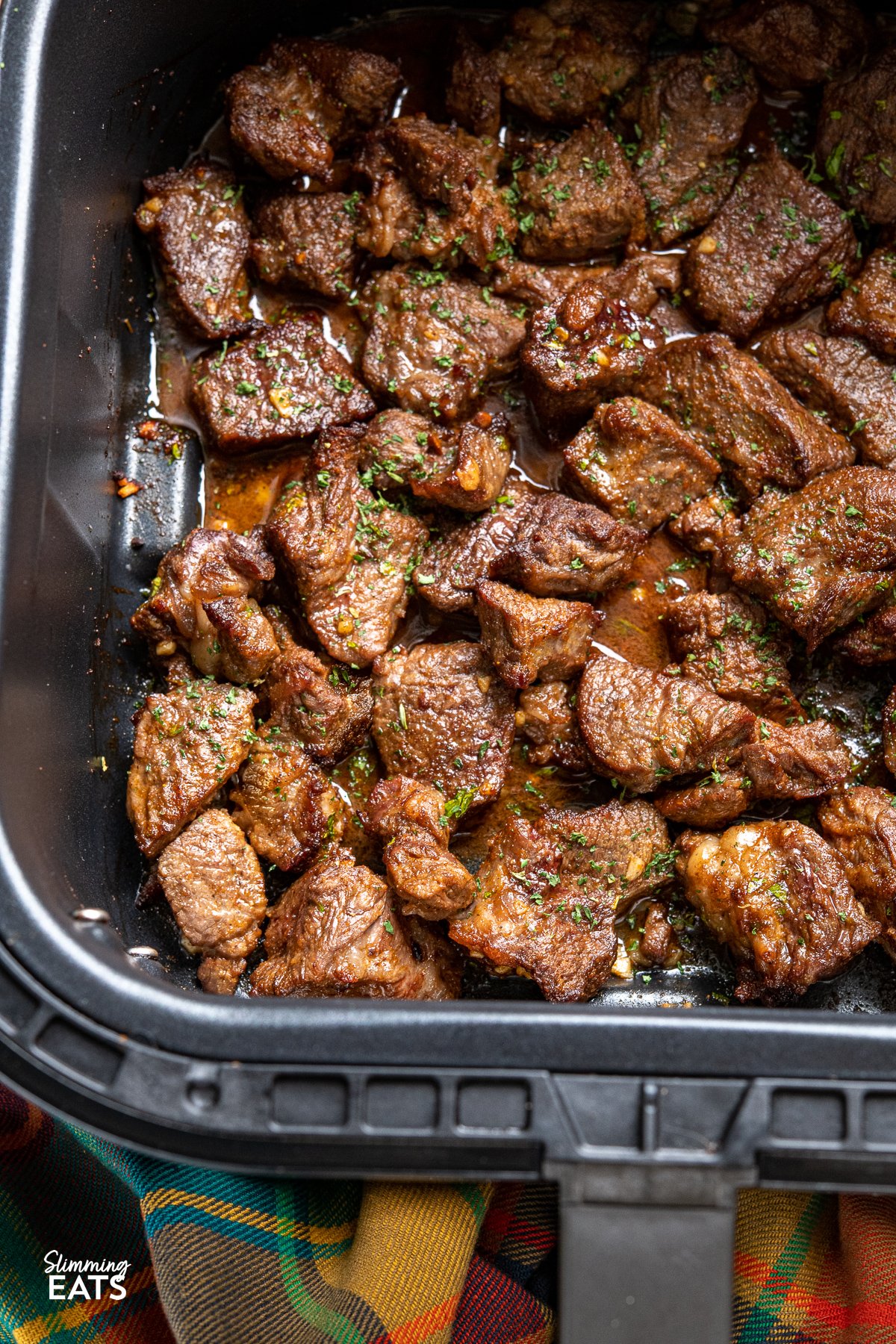 Air Fryer Garlic Butter Steak Bites in air fryer basket