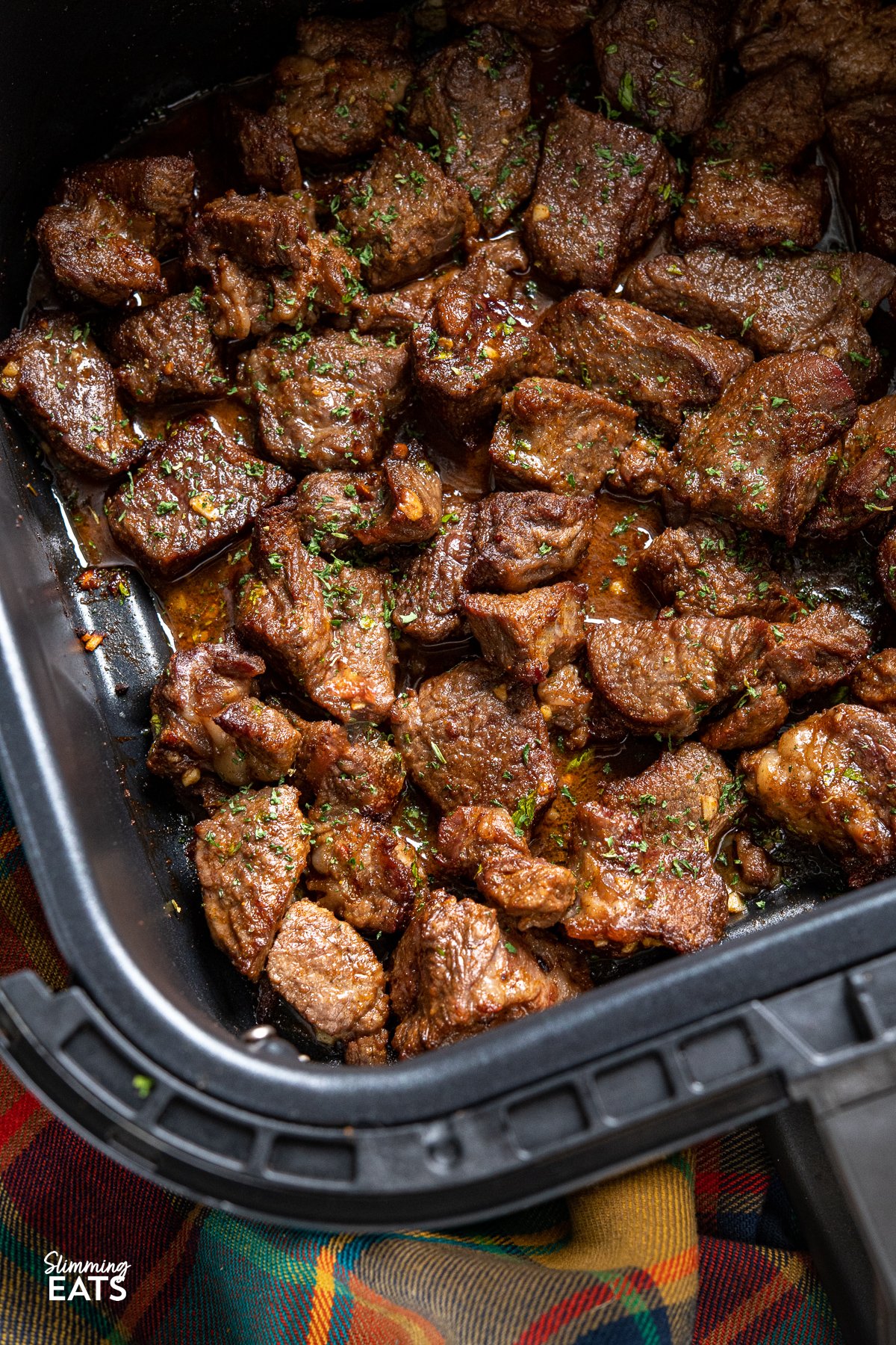 Air Fryer Garlic Butter Steak Bites in air fryer basket