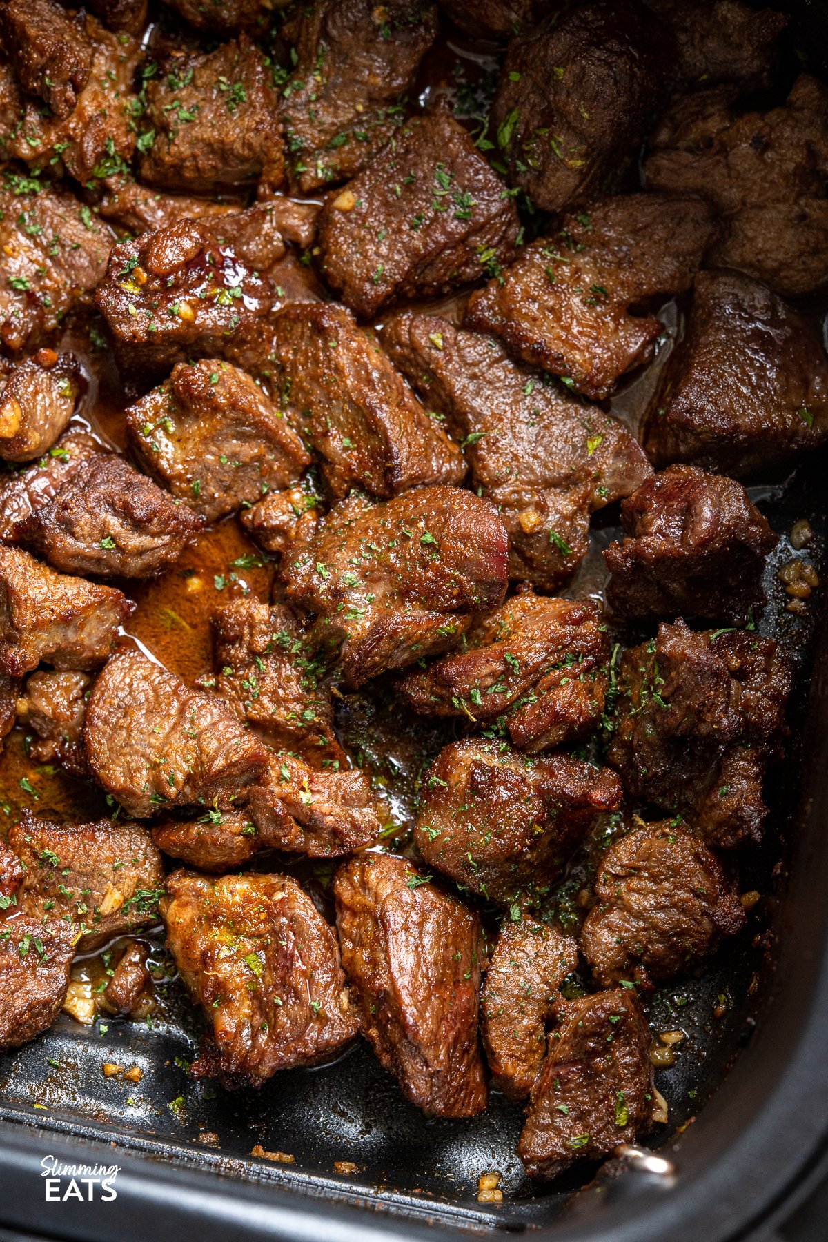 Air Fryer Garlic Butter Steak Bites in air fryer basket