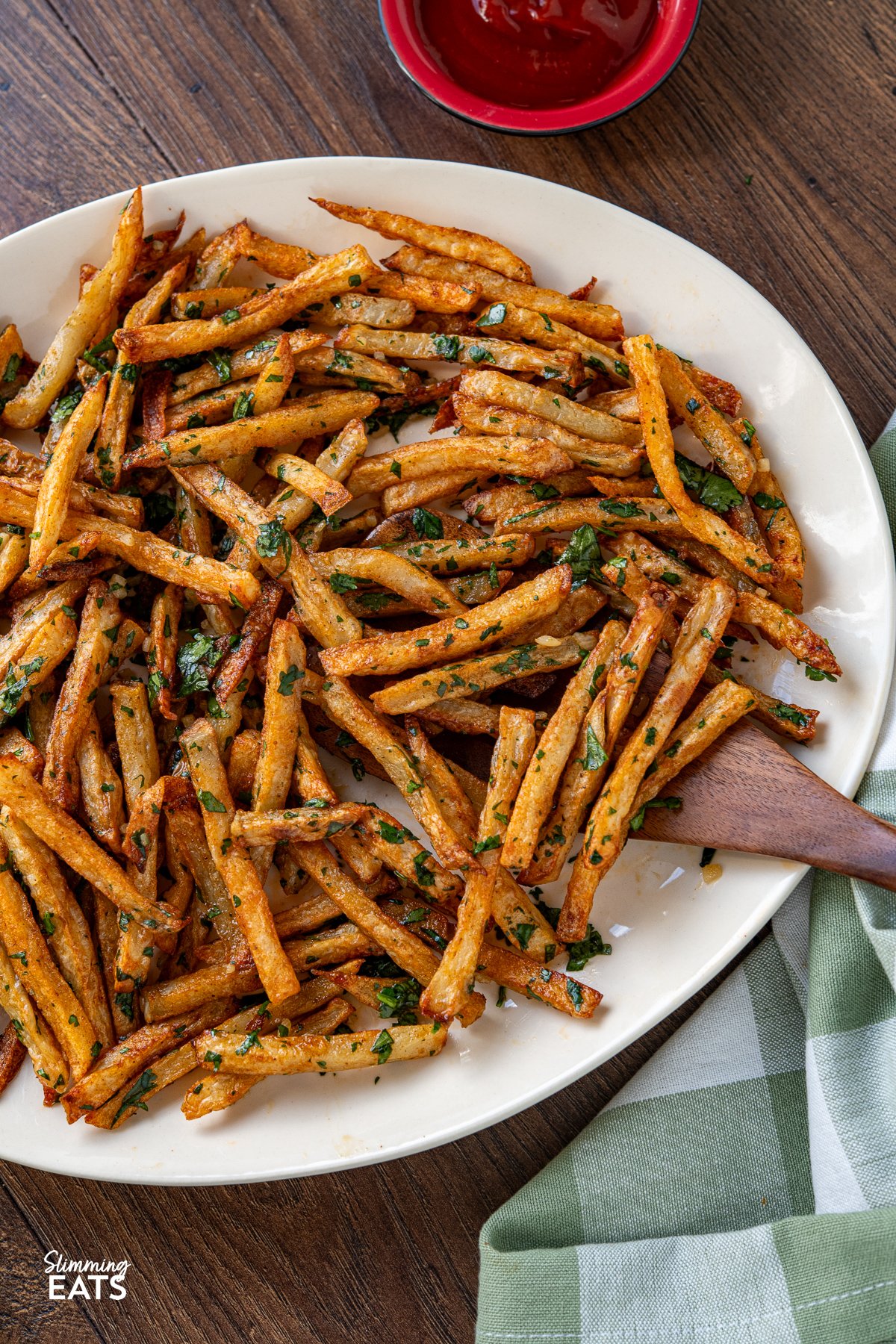 Savour the delicious fusion of these oven-baked seasoned fries, boasting a perfect crispiness, and the tantalizing harmony of garlic, butter, and cilantro. These delectable Garlic Cilantro Fries aren't just a side dish; they're a culinary revelation, ready to be relished either on their own with your preferred dip or as the star of any meal.