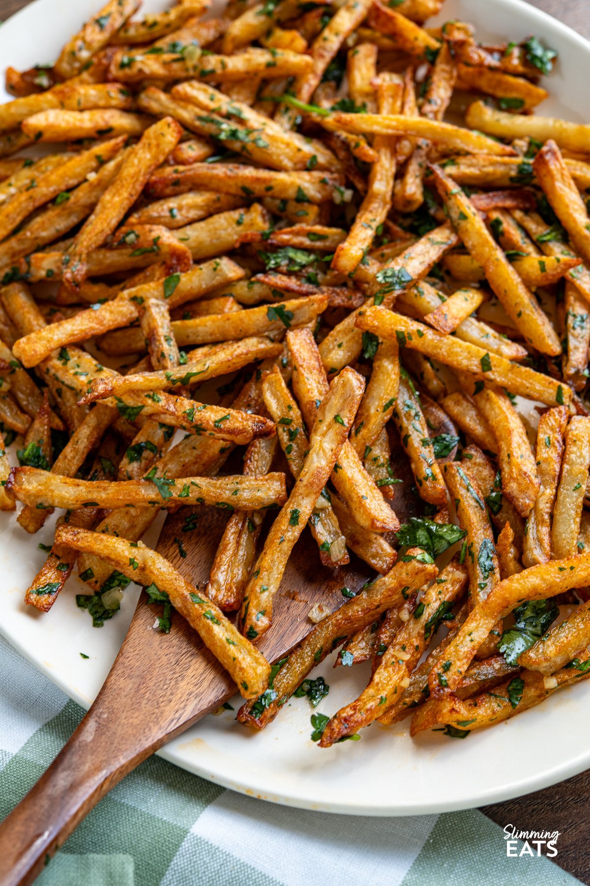 close up of Garlic Cilantro Oven Baked Fries on oval plate