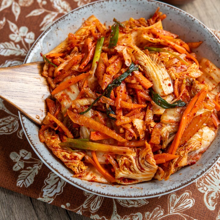 quick fresh kimchi freshly prepared in a large bowl with wooden spoon place in kimchi
