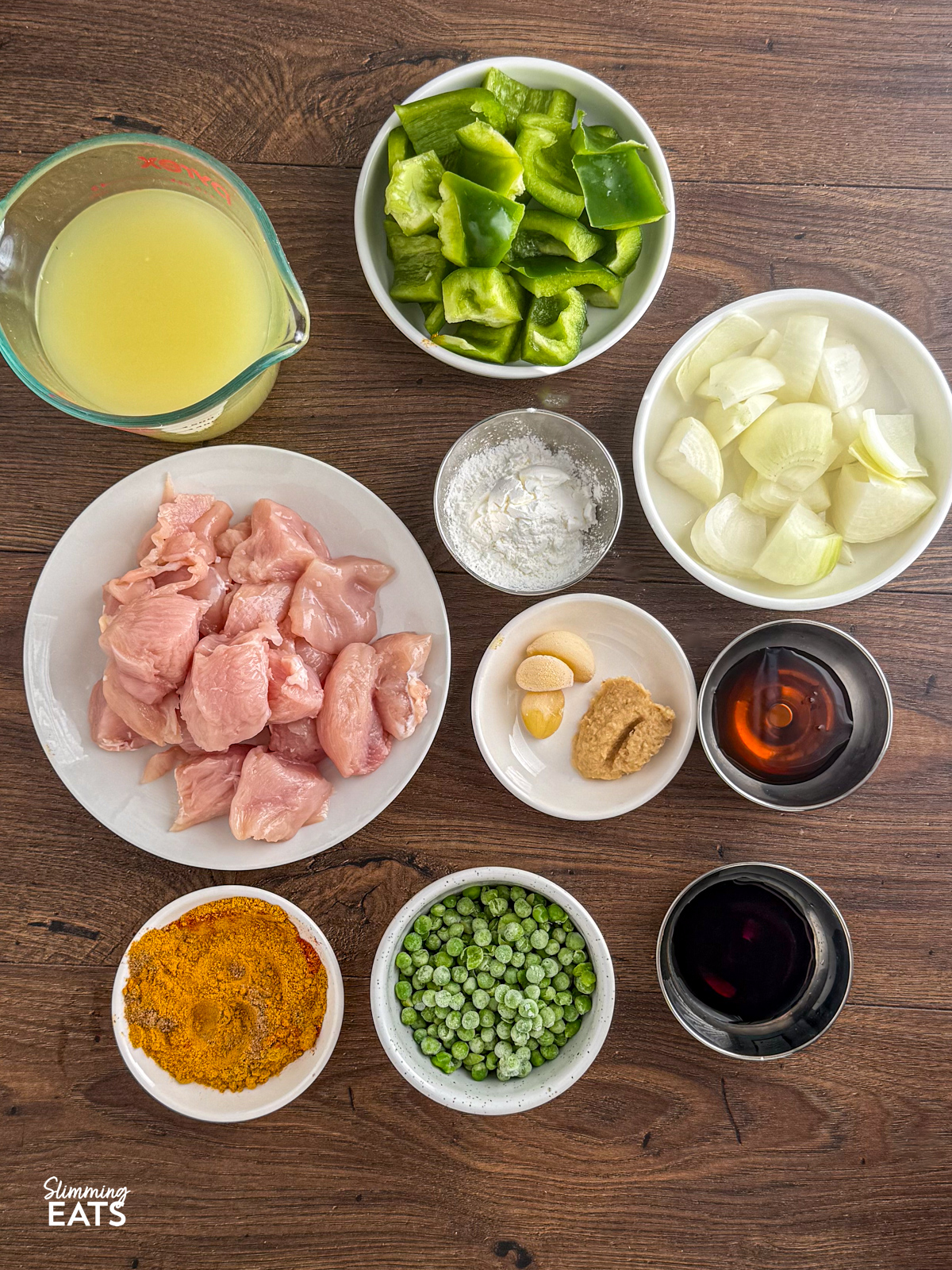 all the ingredients for Slow Cooker Chinese Chicken Curry on a board in bowls
