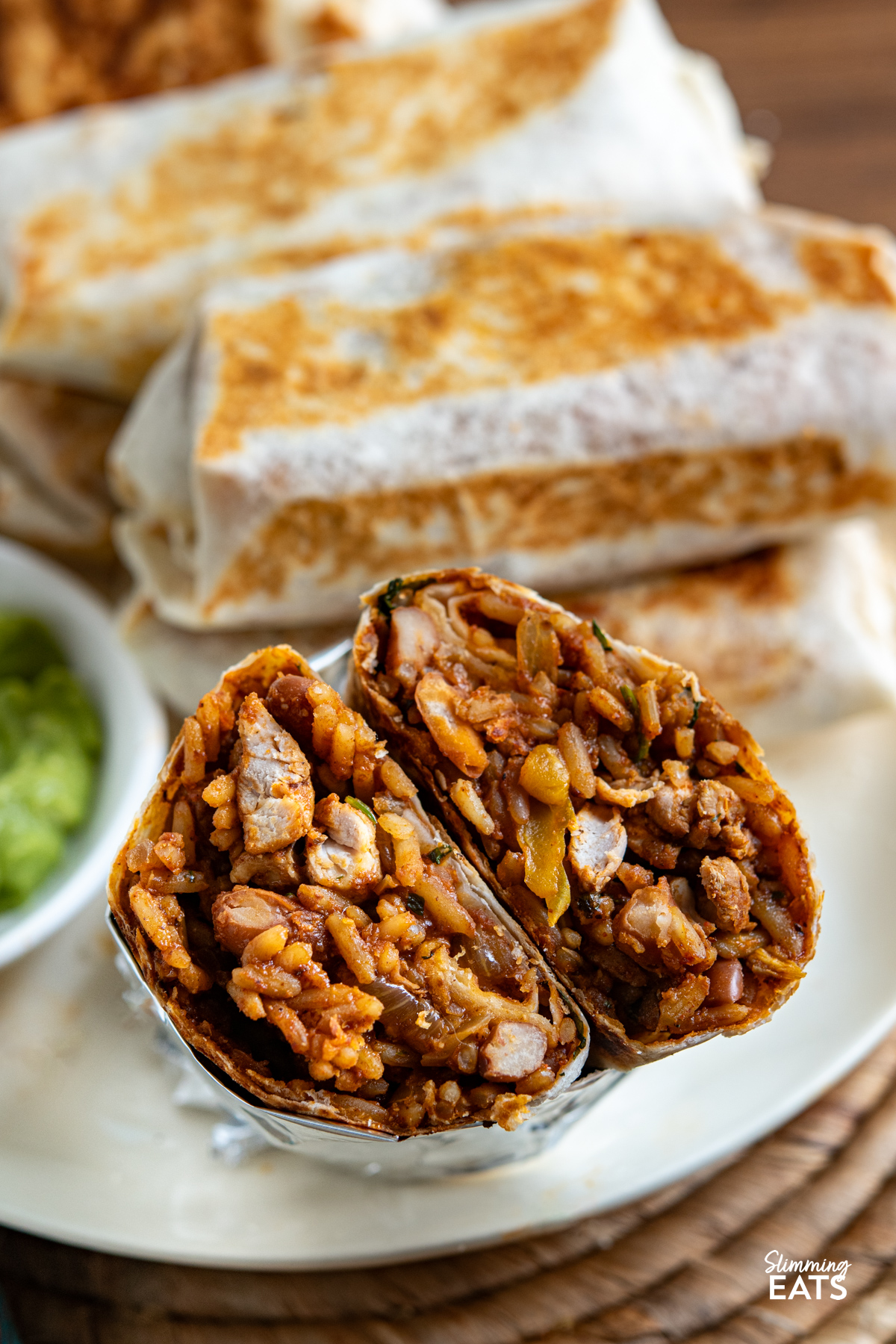 close up of cut open One Pan Chicken Rice Burritos 