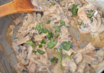 cream cheese stirred into mushrooms until creamy and sprinkled with parsley
